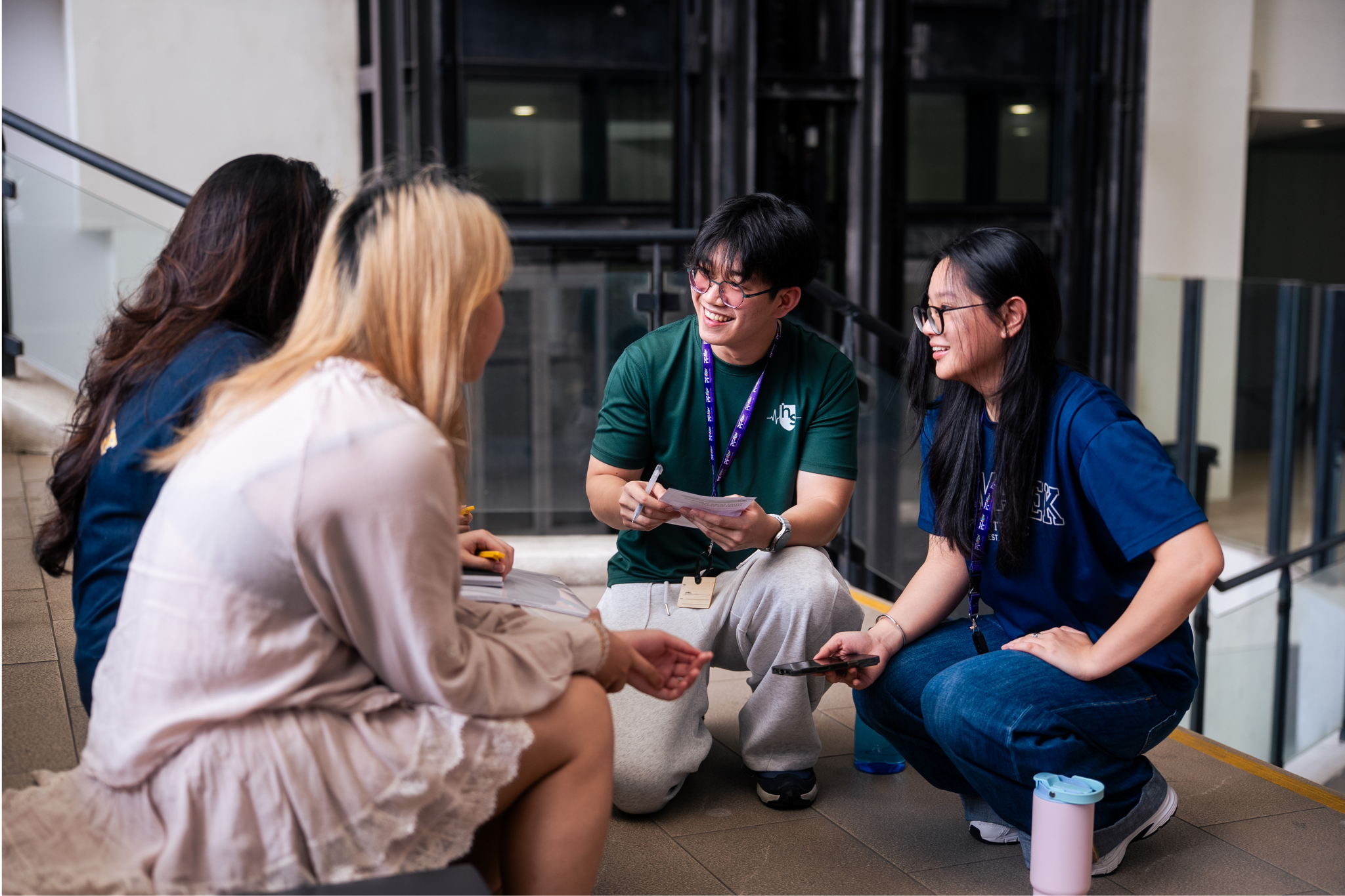Student delegates engage members of the public in conversations during a street interview activity at LASALLE.